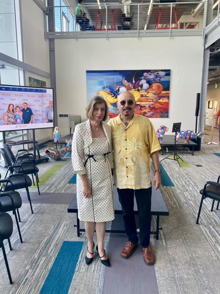 Artist Susanne Schuenke and Jorge Rivera, First Coast TV producer, at the Cultural Center’s ‘Grand Opening of the Arts’ at the link on Thursday, July 15.